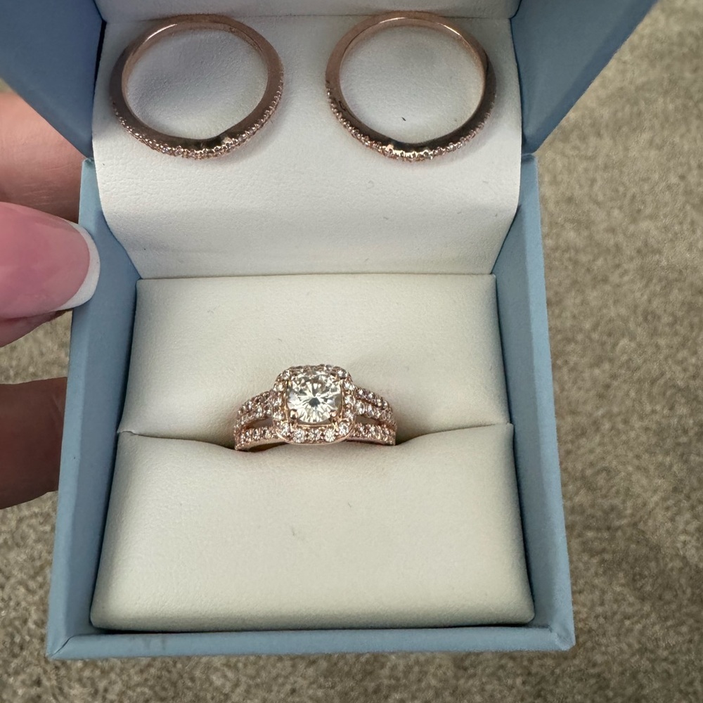 Charles & Colvard Certified Moissanite wedding ring with two matching bands.